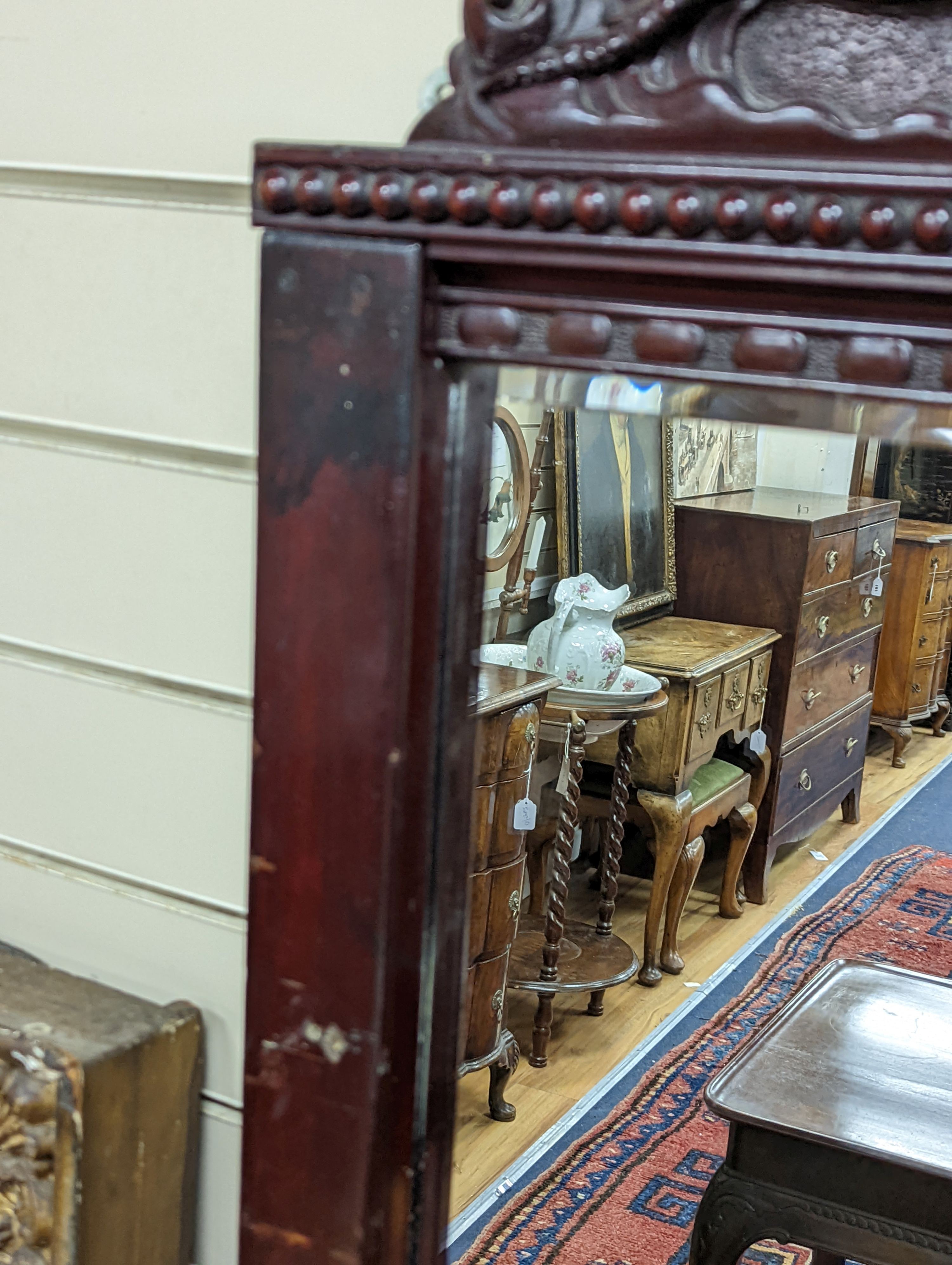 A Japanese carved hardwood dragon overmantel mirror, width 112cm, height 180cm